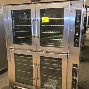 Doyon JA0P10 combination oven and proofer. Features stainless steel construction, glass doors, and independent controls for oven and proofer sections.