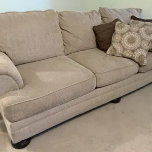 Beige Cloth Sofa Featuring Rolled Arms