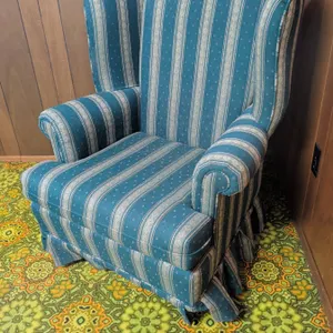 Upholstered Wingback Armchair with Striped Pattern