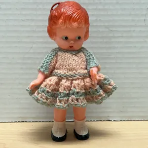 4" Plastic Doll with Red Hair in Hand-Knitted Pink and Blue Dress and Black Shoes, Circa Mid-20th Ce