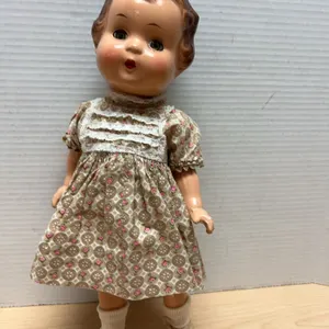 Composition Sleep-Eye Doll with Brown Hair, Patterned Dress, and Yellow Shoes, Approximately 15 Inch