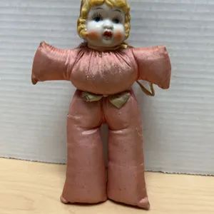 Early 20th Century Porcelain Head Doll with Blonde Hair and Pink Fabric Body, 7 Inches Tall, Hand-Pa