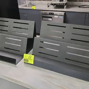 Poly 2-tier display. Features a dual-step slotted design for product visibility and airflow. Constructed from durable black poly material. Designed fo