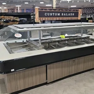 Atlantic ISB11864-DC-ECS-LB-SPRN-SSC-VH 15-well cold bar island. Features wood-look laminate base, black trim, solid surface countertop, glass sneeze 