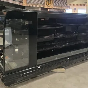 Hussmann IM-05-CN-6-R low profile 4-way multi-deck island display case. Features multi-tier black shelving, open merchandiser design, and integrated e