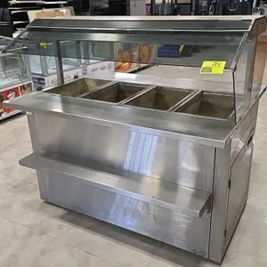 Atlantic Food Bars MHFC6044-BP1-U0 5'L stainless steel portable 4-well hot food bar. Features glass sneeze guard, overhead heat lamps, and integrated 