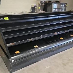 2016 Hillphoenix O3.25UM12 (DX)(NRG) 12'L low-profile multi-deck display case. Features three rows of adjustable shelves, LED lighting, and a black fi