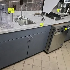 10'L gray laminate lower cabinet. Features a 15" x 15" T&S Brass stainless steel drop-in sink with gooseneck faucet, wall-mounted Ecolab soap dispense