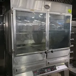 2017 Old Hickory N/7.7G stainless steel portable natural gas rotisserie barbeque. Features 2 glass doors, 4 cook burners (40,000 BTU/H each), and 1 di