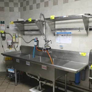 Stainless steel 3-compartment sink. Features three 18" x 24" x 11" deep bowls, 1-1/2' x 2-1/2' left and right drainboards, and a prerinse faucet assem