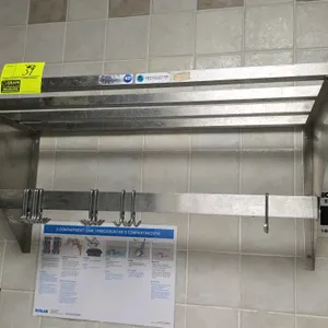 M&E wall-mounted stainless steel rack. Features a tubular slatted top shelf and a lower bar with sliding hooks. NSF certified. 40" x 15". Note: Pre-ri