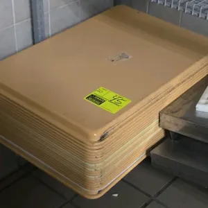 Full-size poly sheet pans. Tan plastic construction. Dimensions: 18"W x 26"D.