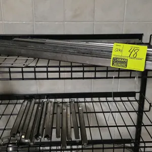 Quantity of stainless steel food pan insert dividers. Includes 12" and 30" lengths designed for steam tables or prep tables. Shelving unit not include