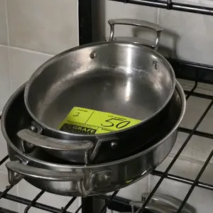 Vollrath 43420 stainless steel gratin dish. Features an oval shape with dual welded loop handles and a polished interior finish. NSF certified.
