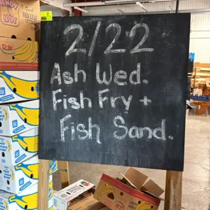 Custom sidewalk chalkboard sign stand. Features a double-sided chalkboard surface on a wooden leg frame. Dimensions: 4' x 6'. Free-standing base. Back