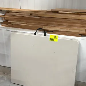 Lifetime bi-fold polyethylene folding table. Features a fold-in-half design with a built-in carrying handle and gray metal folding legs. 6'L. Wood pla