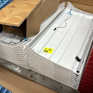 Assorted case shelving. Features white metal construction with integrated price ticket moldings and under-shelf lighting wiring connectors. Stacked on