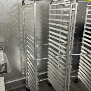 Aluminum full-size front-load channel sheet pan rack. Features a 20-tier capacity. Equipped with four swivel casters for mobility. Pans not included.