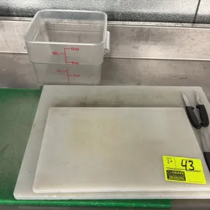 Assorted commercial kitchen prep lot. Includes (3) polyethylene cutting boards (one green, two white), (4) utility knives with black handles, and (1) 