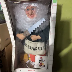 Falco Animated Christmas Display Figure With Saw, 1993, Porcelain
