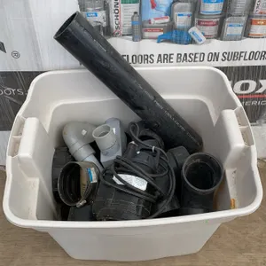 Tub of PVC Drain Fittings and Pump with Miscellaneous Parts