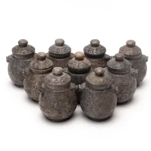 SET OF NINE CHINESE CARVED MINIATURE JARS