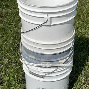 Stack of 18.9L empty buckets