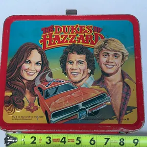 This image shows a vintage 1980 Dukes of Hazzard metal lunch box  w/ thermos