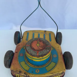 Vintage Ohio Art Company "Turf Rotor" toy lawn mower from the 1950s