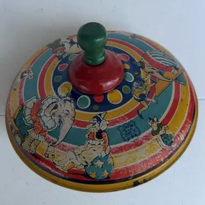 Vintage J. Chein & Co. tin litho spinning top,featuring a colorful circus scene