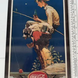 This is a vintage 17 x 11 metal advertising Coca Cola sign