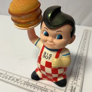 This Big Boy restaurant promotional figure is a vinyl piggy bank featuring the iconic mascot holding