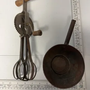Pair of vintage kitchen items. Egg beater, and Strainer
