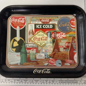 1990 Ohio Art Coca-Cola tray features a collage of memorabilia titled "Through the Years"