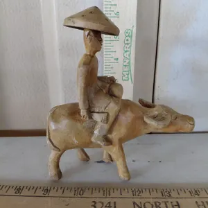 Vintage Carved Wood Man Riding Oxen
