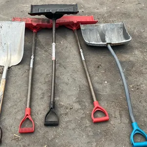 OFFSITE - 4 snow scrapers and an aluminum shovel.