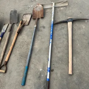 OFFSITE - Spades, shovel, pick axe and cement rake.