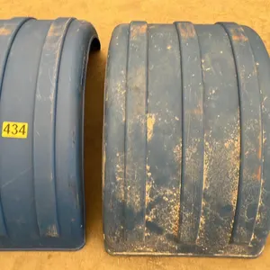 OFFSITE - 2 Mud guards or full wheel fenders for Highway tractor or trailer. Crafted from polyethylene, a durable plastic fender. 25.5” wide , bottom 