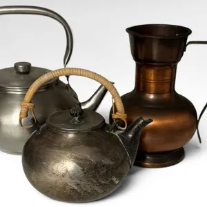 Three Metalware Items: Copper Pitcher, Silverplate Teapot, and Chrome Teapot with Woven Handle