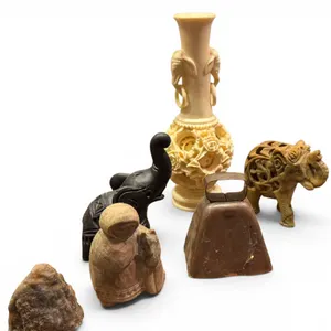 Eclectic Lot of Carved Stone and Metal Objects with Decorative Vase