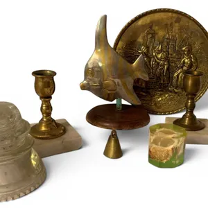 Decorative Items Including Brass Candlesticks, Glass Insulator, and Sculptures