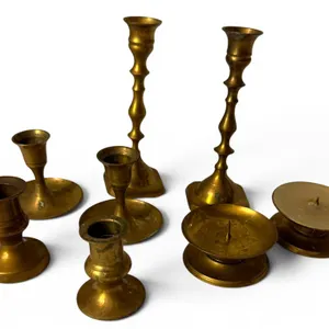 Seven Brass Candle Holders in Various Designs
