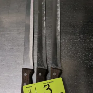 Stainless steel carving knife. Features a 14" stainless steel blade and a wood handle secured with three metal rivets.