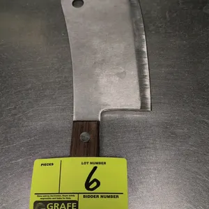 Stainless steel cleaver. Features an 8"L stainless steel blade with a hanging hole and a dark wood handle secured by two rivets. Ideal for commercial 