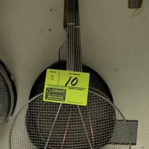 Assorted metal kitchen strainers. Includes two wire spider strainers with long wire handles and one deep mesh strainer featuring a wooden handle grip 
