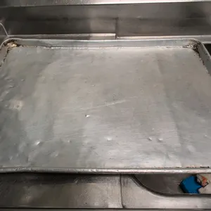 Aluminum sheet pan. Features a wire-reinforced rim. 18" x 26". Shelving and background items not included.