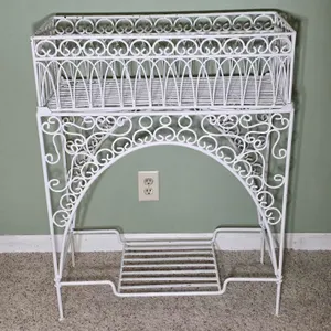 Two Piece Wrought Iron Planter. 26.5 x 11.5 x 35. *you must bring adequate help to remove and load. Located in basement. B
