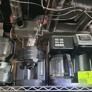 Kitchen appliance lot. Includes (1) Keurig Duo coffee maker with glass carafe, (1) Keurig single-serve coffee maker, (1) Capresso espresso machine wit