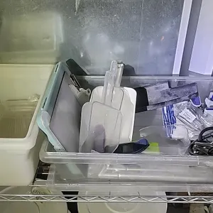 Bulk lot of assorted restaurant and bar supplies. Includes a manual keg pump tap with hose, handheld packaging tape dispenser, plastic food storage bi