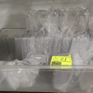 Lot of (19) polycarbonate utility scoops and (1) clear storage tub. Scoops feature a 64 oz capacity, clear polycarbonate construction, and integrated 